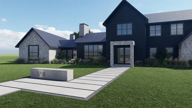 a front view of a house with yard and green space