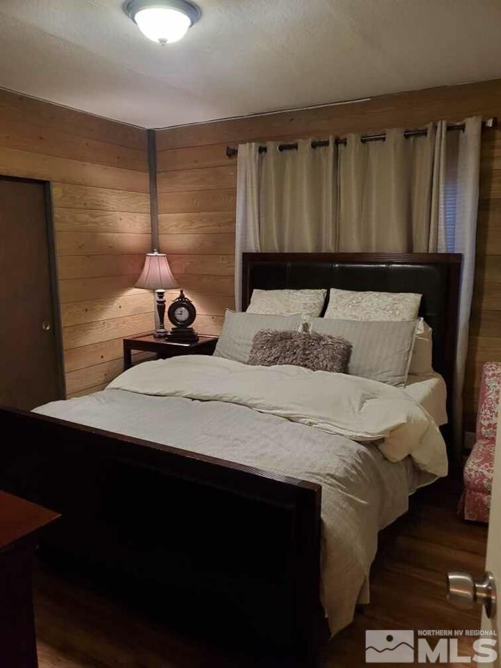 450 Mira Street Reno, NV 89521 - Photo 17 of 25 a bedroom with a bed and a night stand