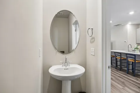 a bathroom with a sink and a mirror