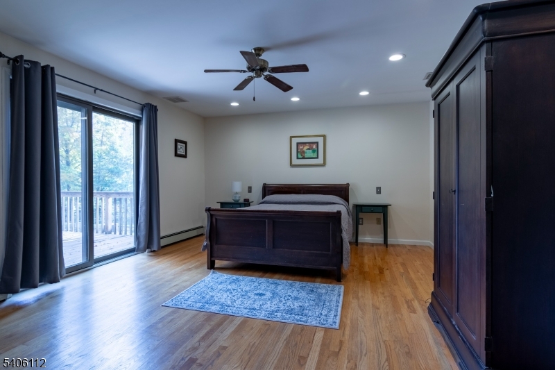 9 Wayside Lane Lebanon, NJ 08833 - Photo 17 of 40 a bedroom with a bed and a large window