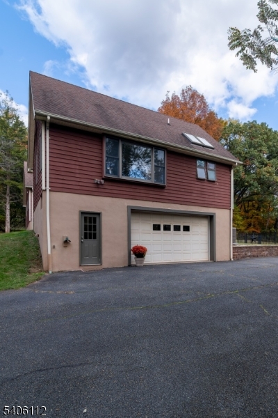 9 Wayside Lane Lebanon, NJ 08833 - Photo 2 of 40 a front view of a house with a garage