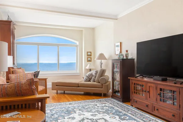 a living room with furniture and a flat screen tv