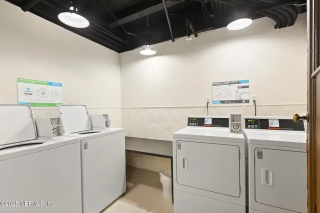 a utility room with dryer and washer