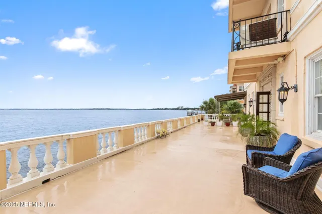 a view of swimming pool with seating space