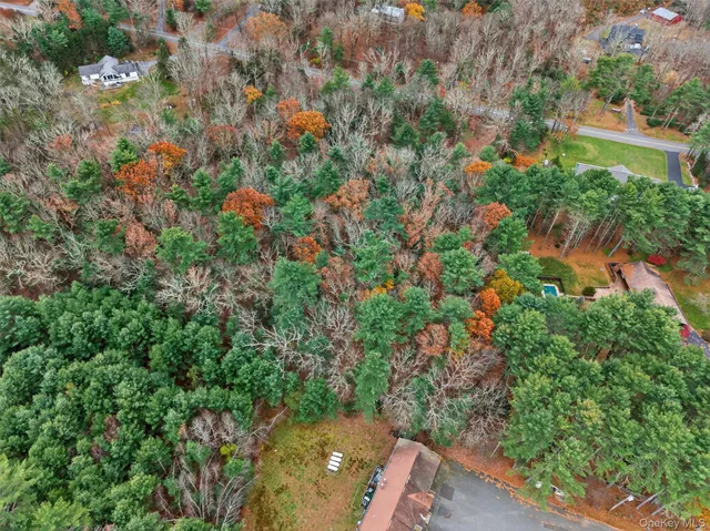 an aerial view of multiple house with yard