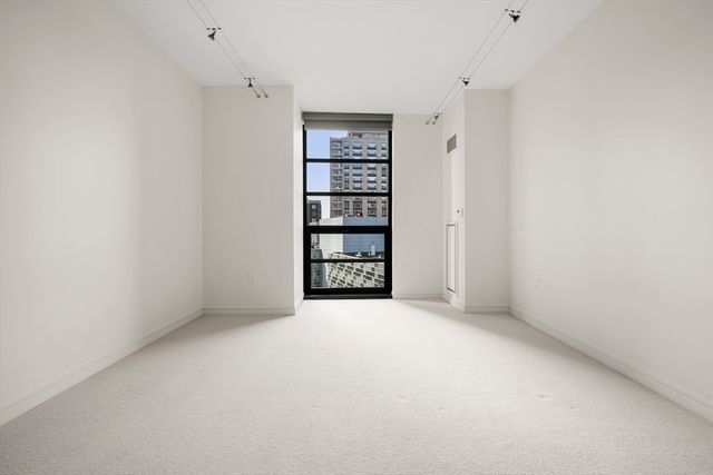 a view of an empty room with a empty shelves