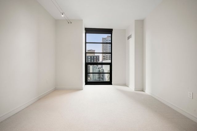 a view of an empty room with empty shelves
