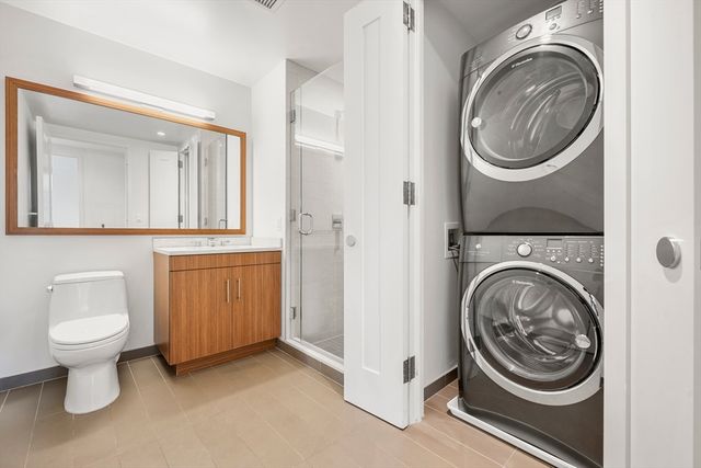 a view of a hallway with washer and dryer