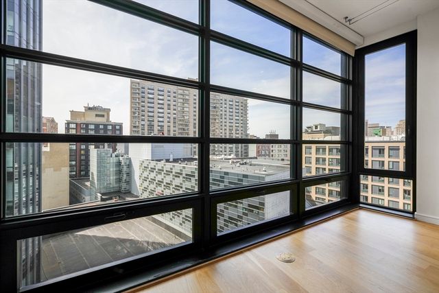 a view of a large window with wooden floor