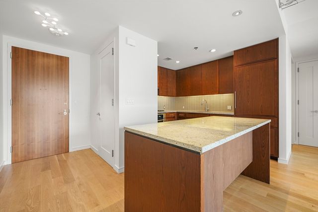 a kitchen with a stove and a refrigerator