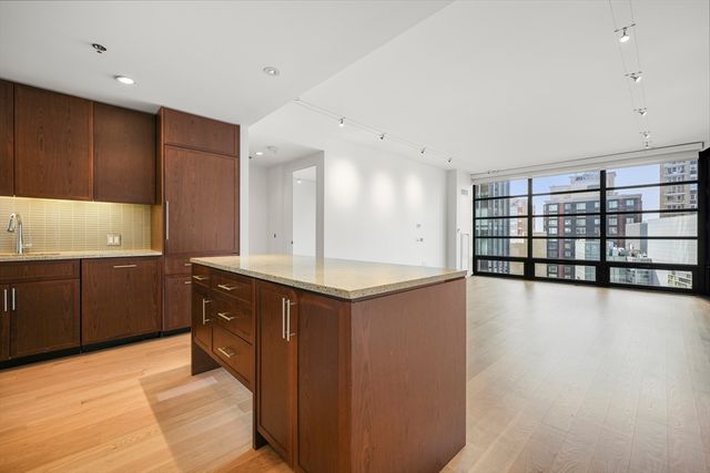 a kitchen with a sink and cabinets
