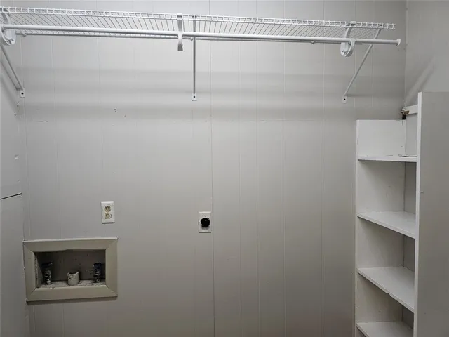 a view of a room with racks on the wall