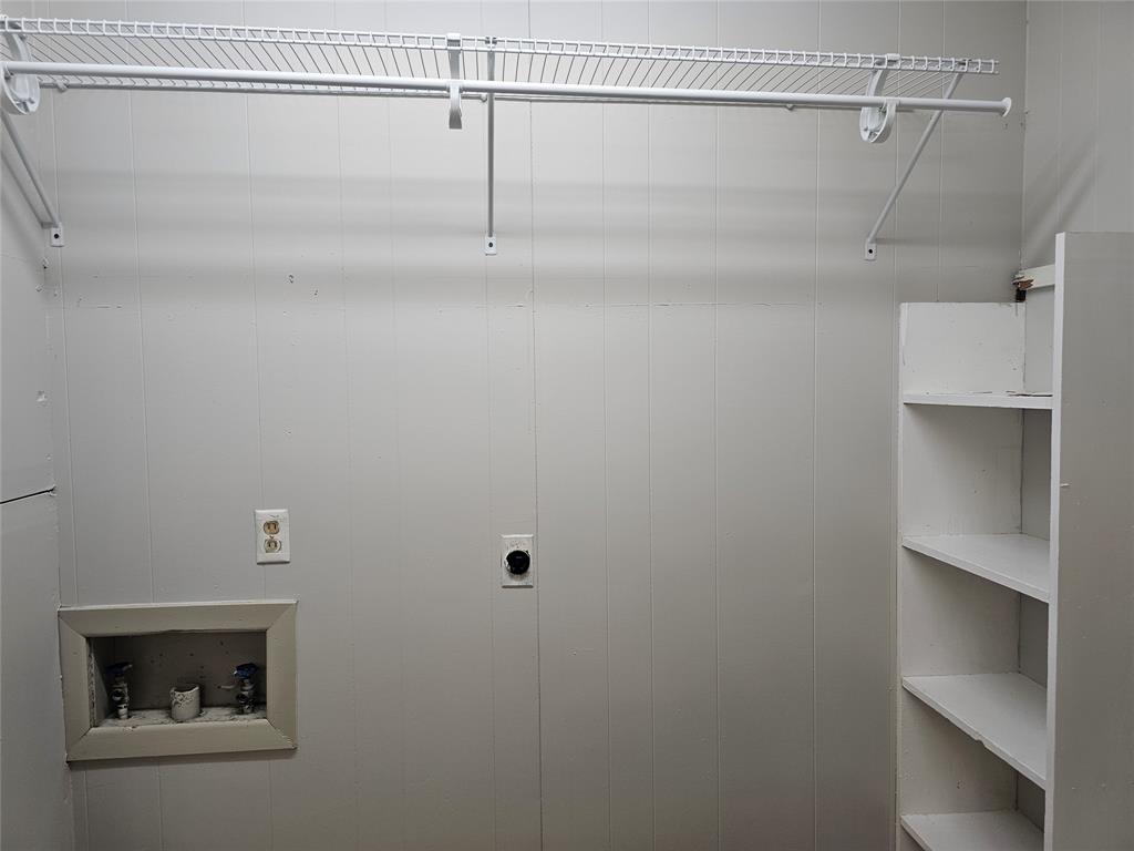 604 East 4th Street Weatherford, TX 76086 - Photo 14 of 20 a view of a room with racks on the wall