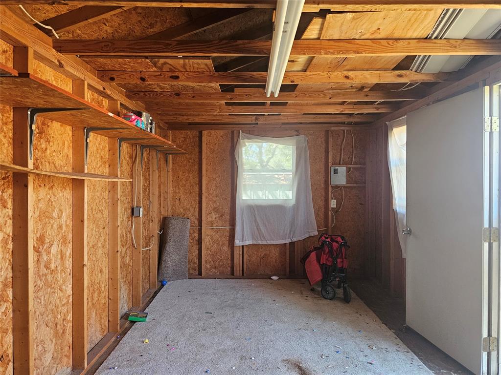 604 East 4th Street Weatherford, TX 76086 - Photo 19 of 20 a view of a room with wooden walls