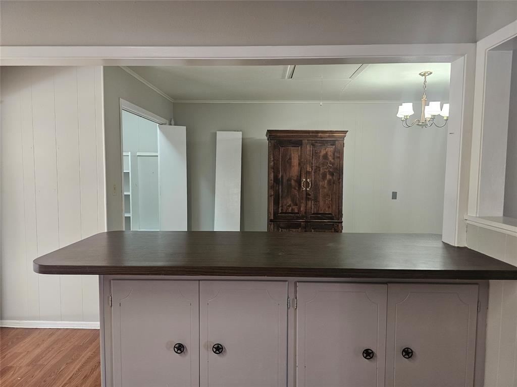 604 East 4th Street Weatherford, TX 76086 - Photo 6 of 20 a view of a hallway with entryway and chandelier