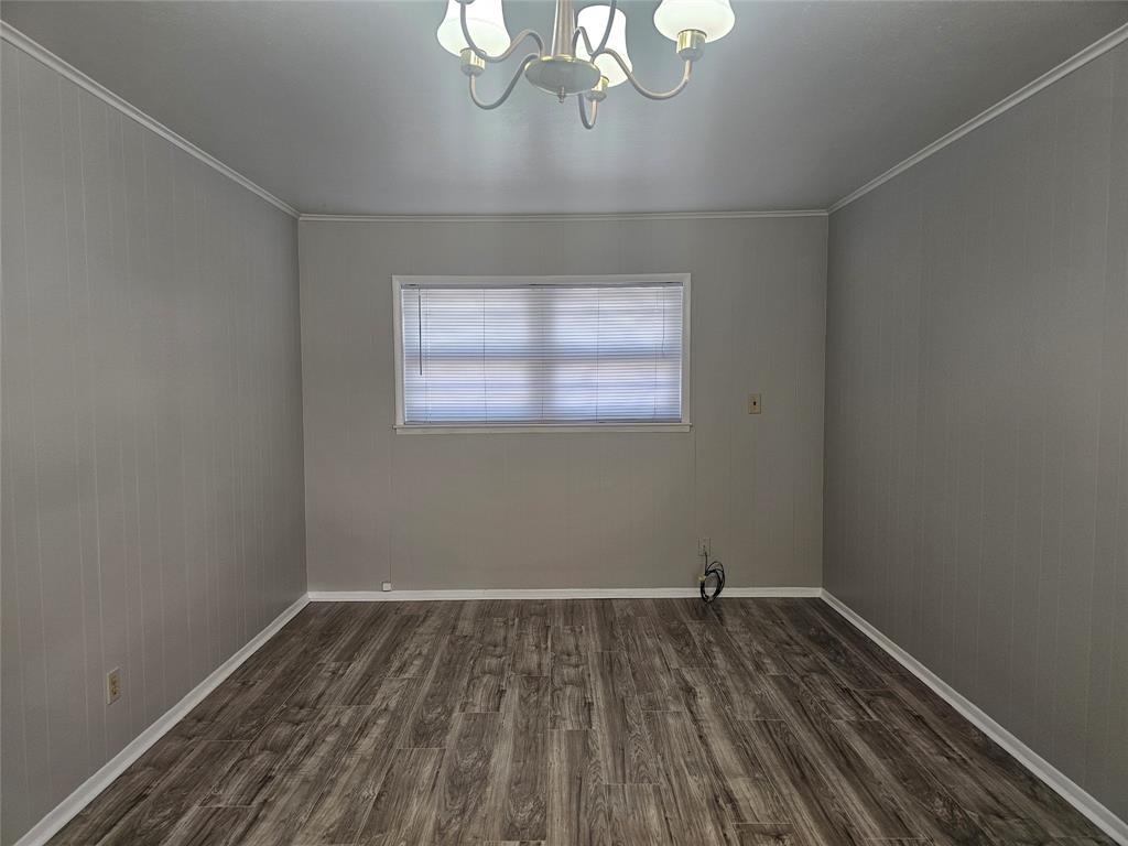 604 East 4th Street Weatherford, TX 76086 - Photo 7 of 20 wooden floor in an empty room with a window