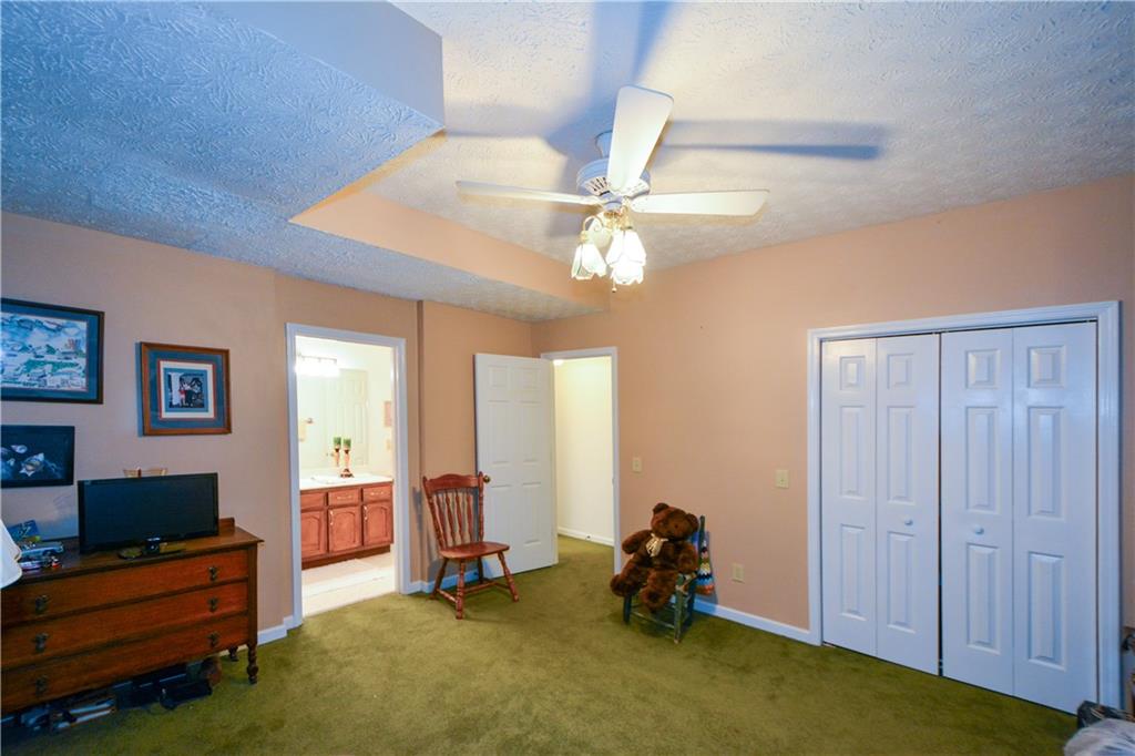130 Hawn Road Fayetteville, GA 30215 - Photo 29 of 67 a livingroom with window and a flat screen tv