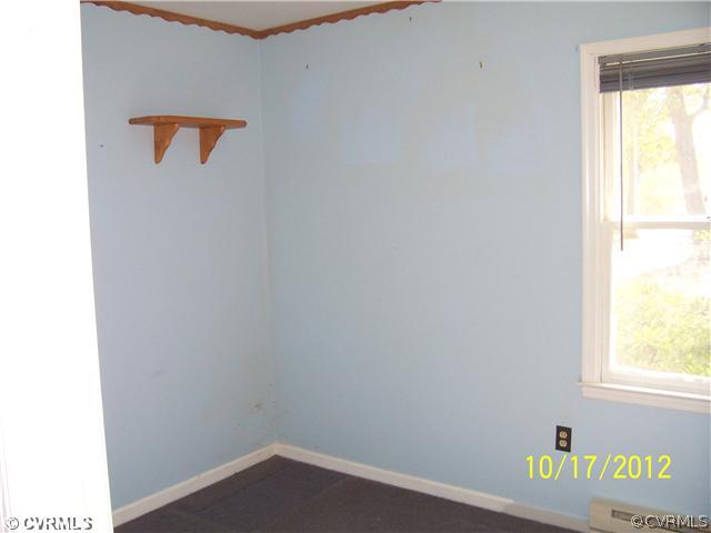 12812 Ruth Hill Road Church Road, VA 23833 - Photo 8 of 12 a view of an empty room with a window