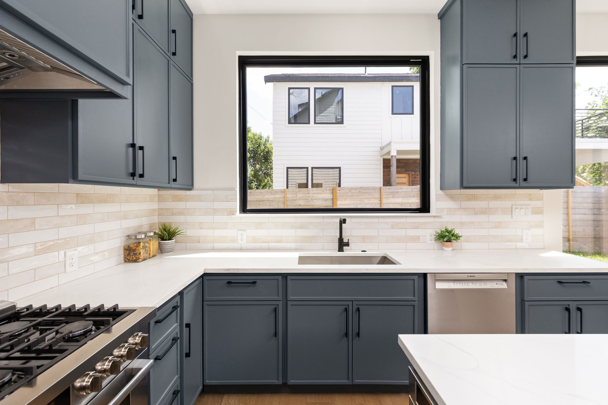 2717 Lyons Road, Unit 1 Austin, TX 78702 - Photo 7 of 40 Culinary adventures await in this kitchen with expansive counters, modern cabinetry, and abundant natural light.