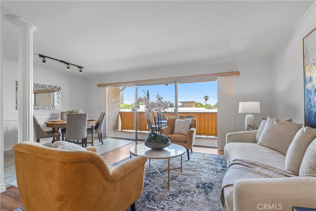 2468 Mohawk Street, Unit 202 Pasadena, CA 91107 - Photo 1 of 29 a living room with furniture wooden floor and a large window