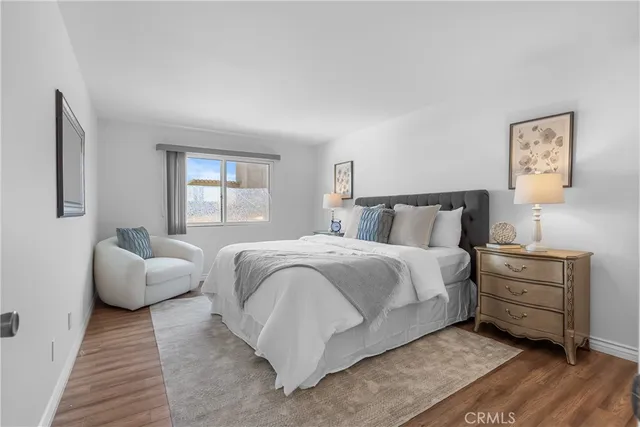 a bedroom with bed and window