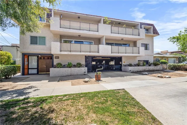 a view of a building with car parked