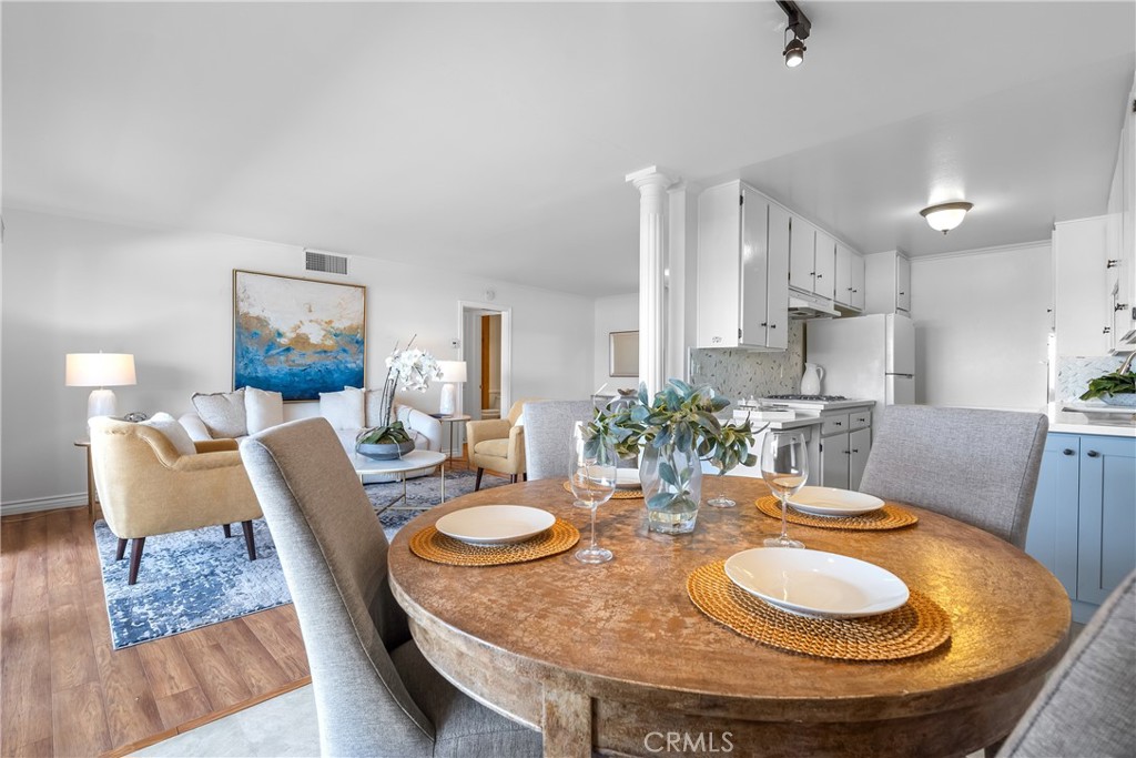 2468 Mohawk Street, Unit 202 Pasadena, CA 91107 - Photo 9 of 29 a dining room with furniture and wooden floor