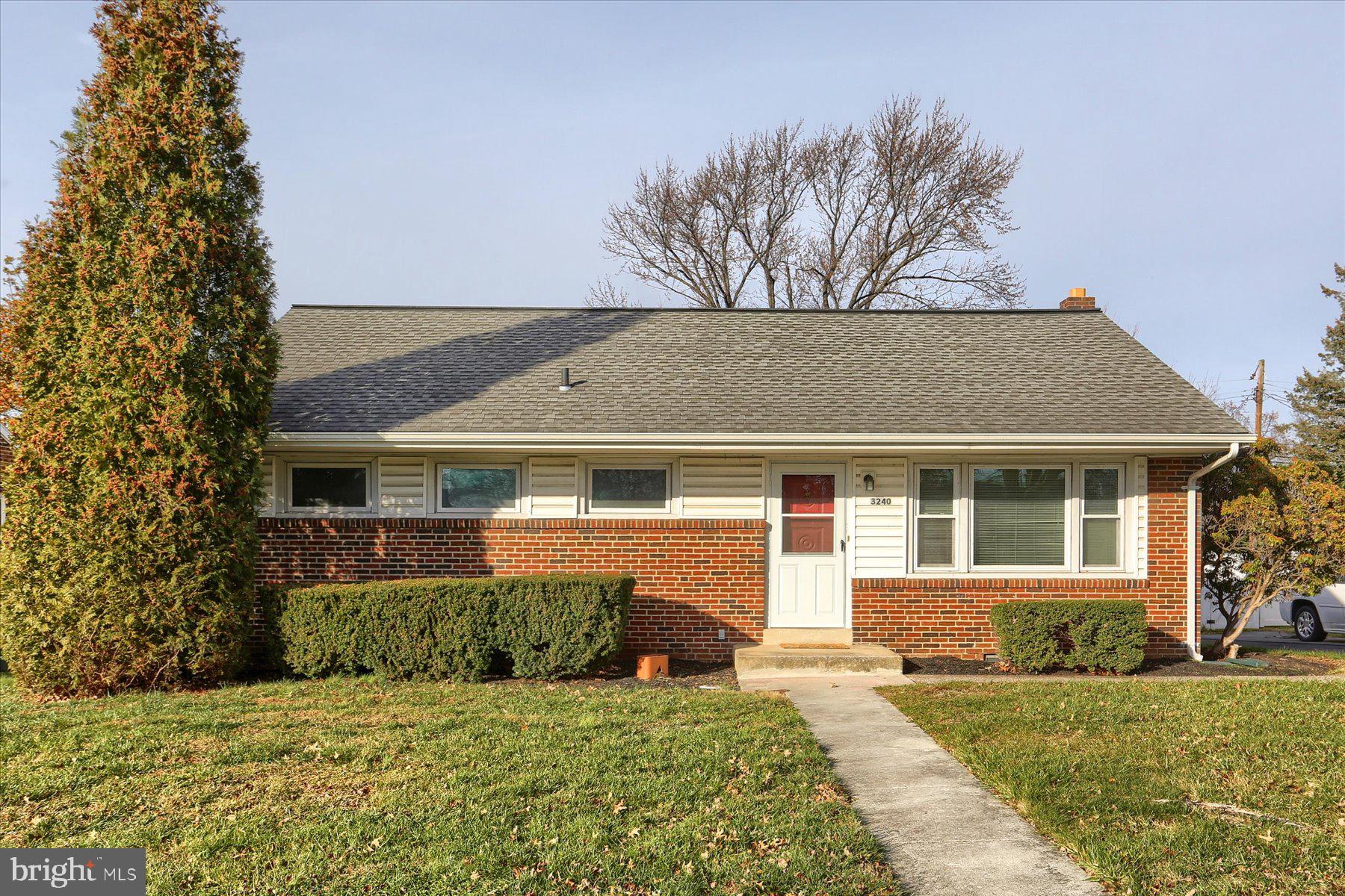 front view of a house with a yard