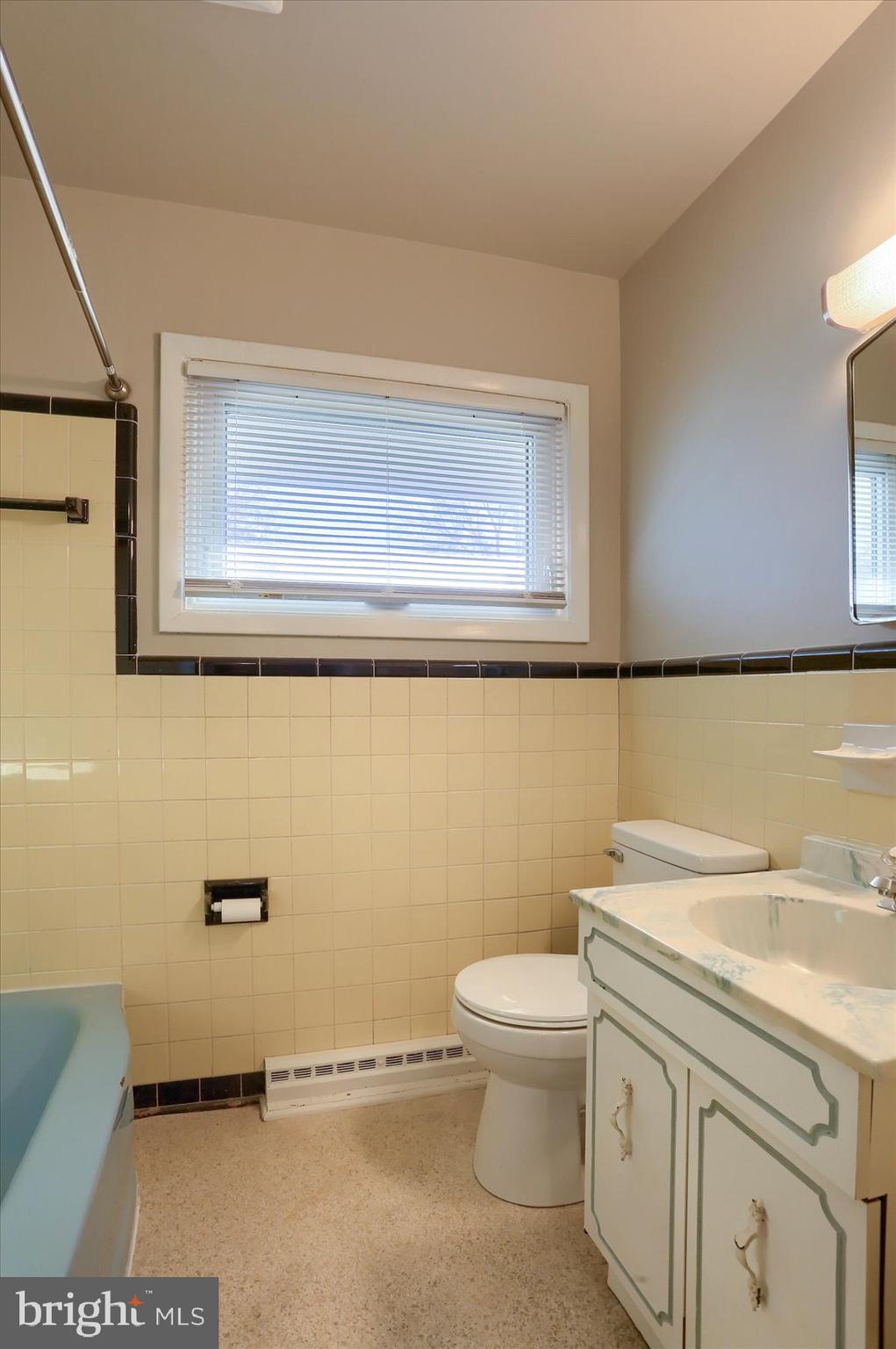 3240 Cloverfield Road Harrisburg, PA 17109 - Photo 17 of 28 a bathroom with a sink a toilet and vanity