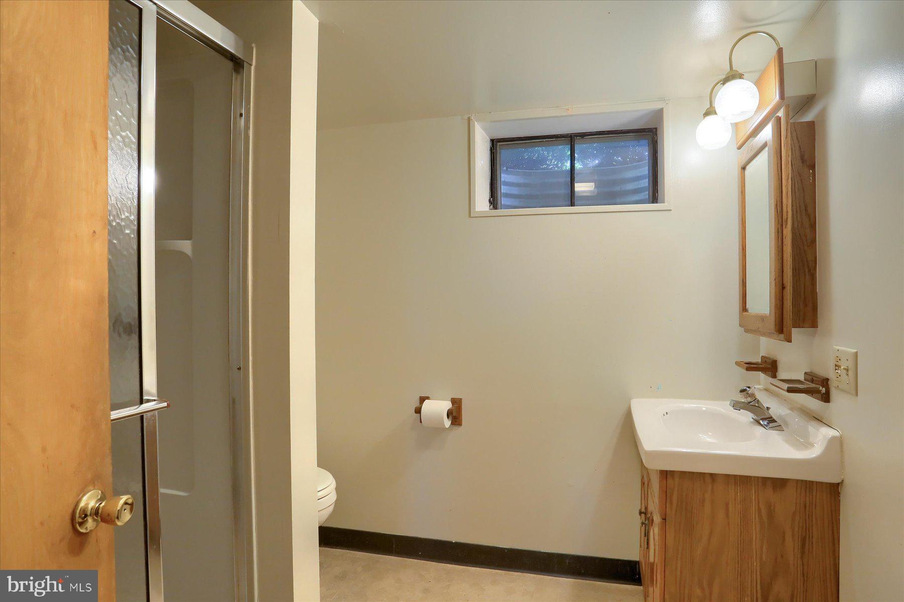 3240 Cloverfield Road Harrisburg, PA 17109 - Photo 18 of 28 a bathroom with a sink and mirror