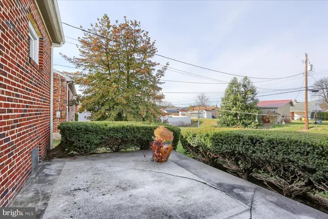 a front view of a house with backyard
