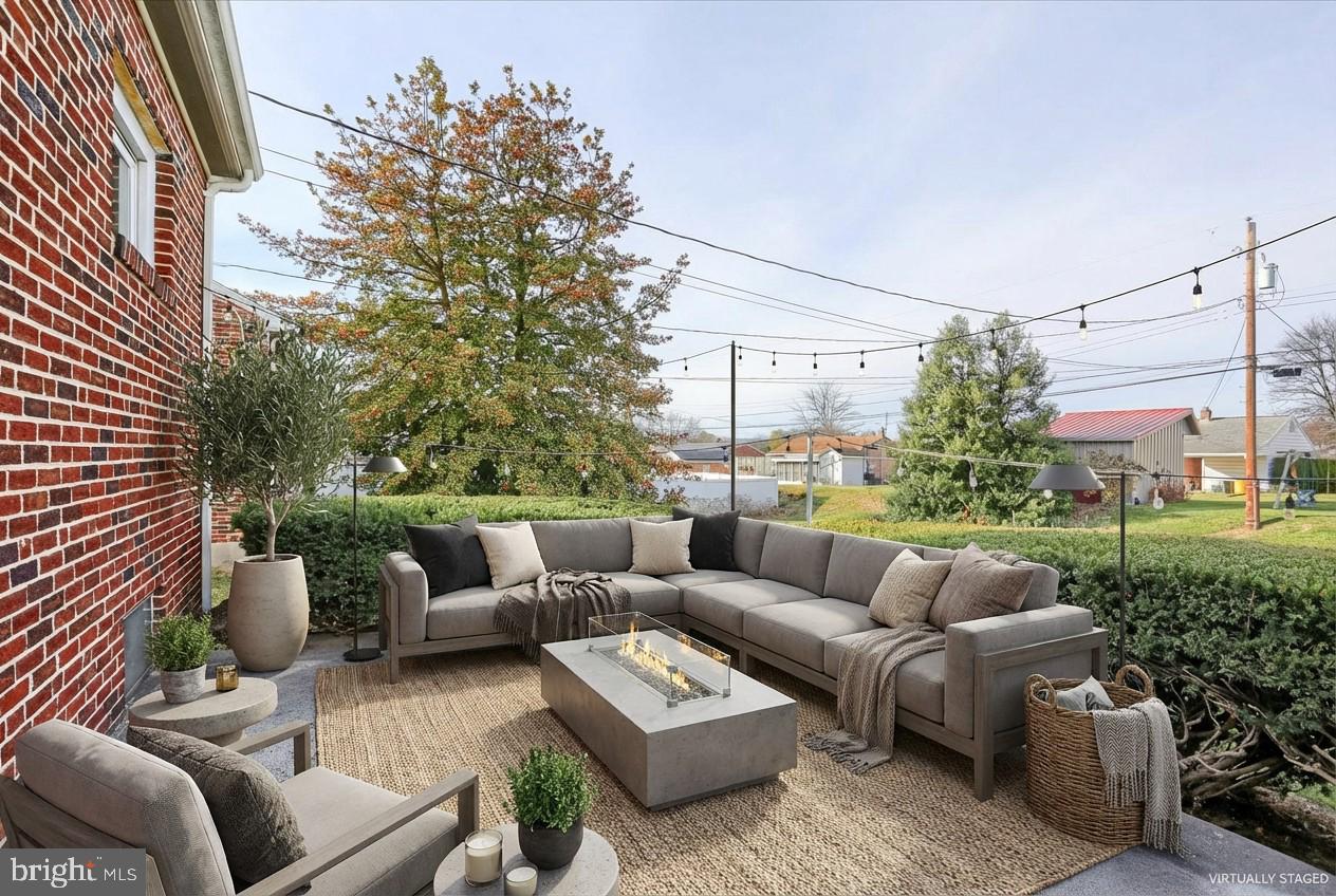 3240 Cloverfield Road Harrisburg, PA 17109 - Photo 26 of 28 a view of a patio with couches and a potted plant on a table