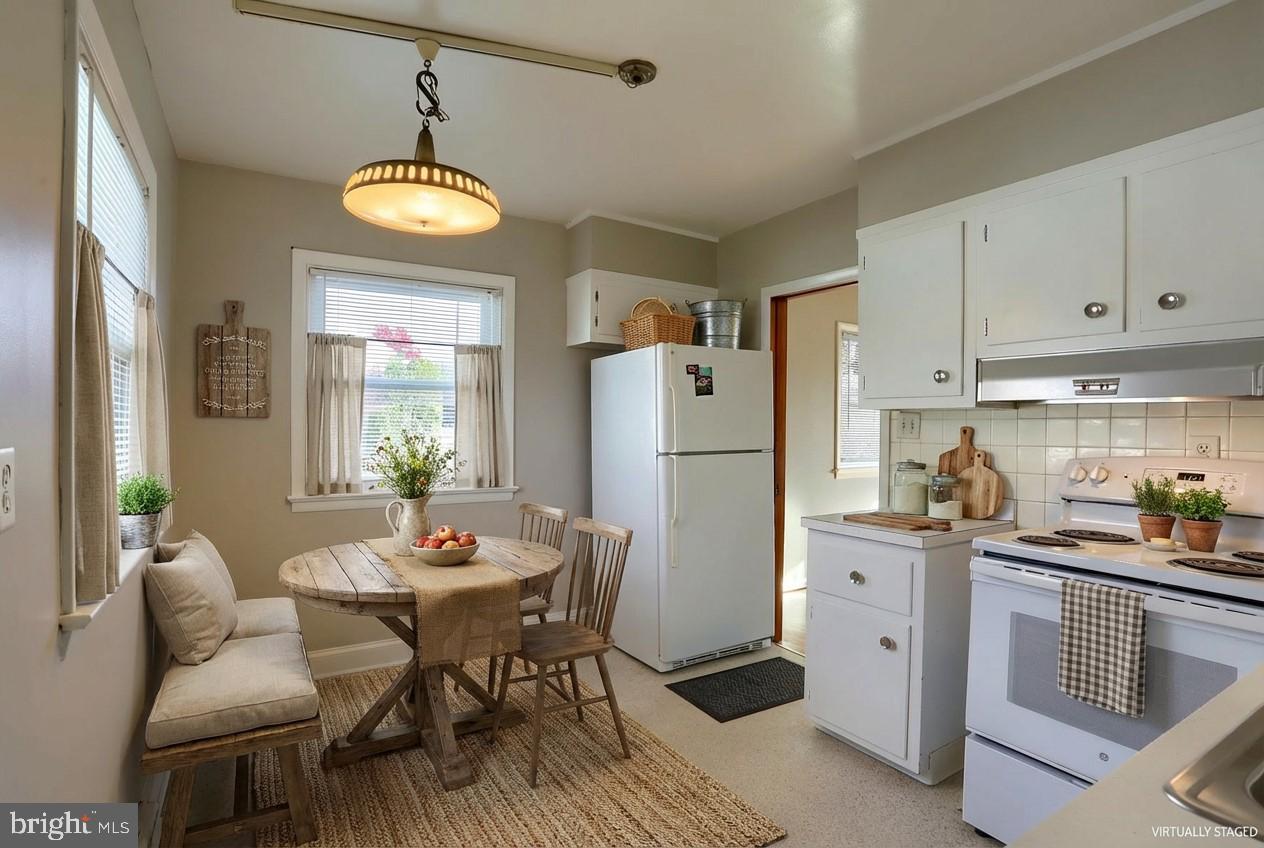 3240 Cloverfield Road Harrisburg, PA 17109 - Photo 7 of 28 a kitchen with a dining table and chairs