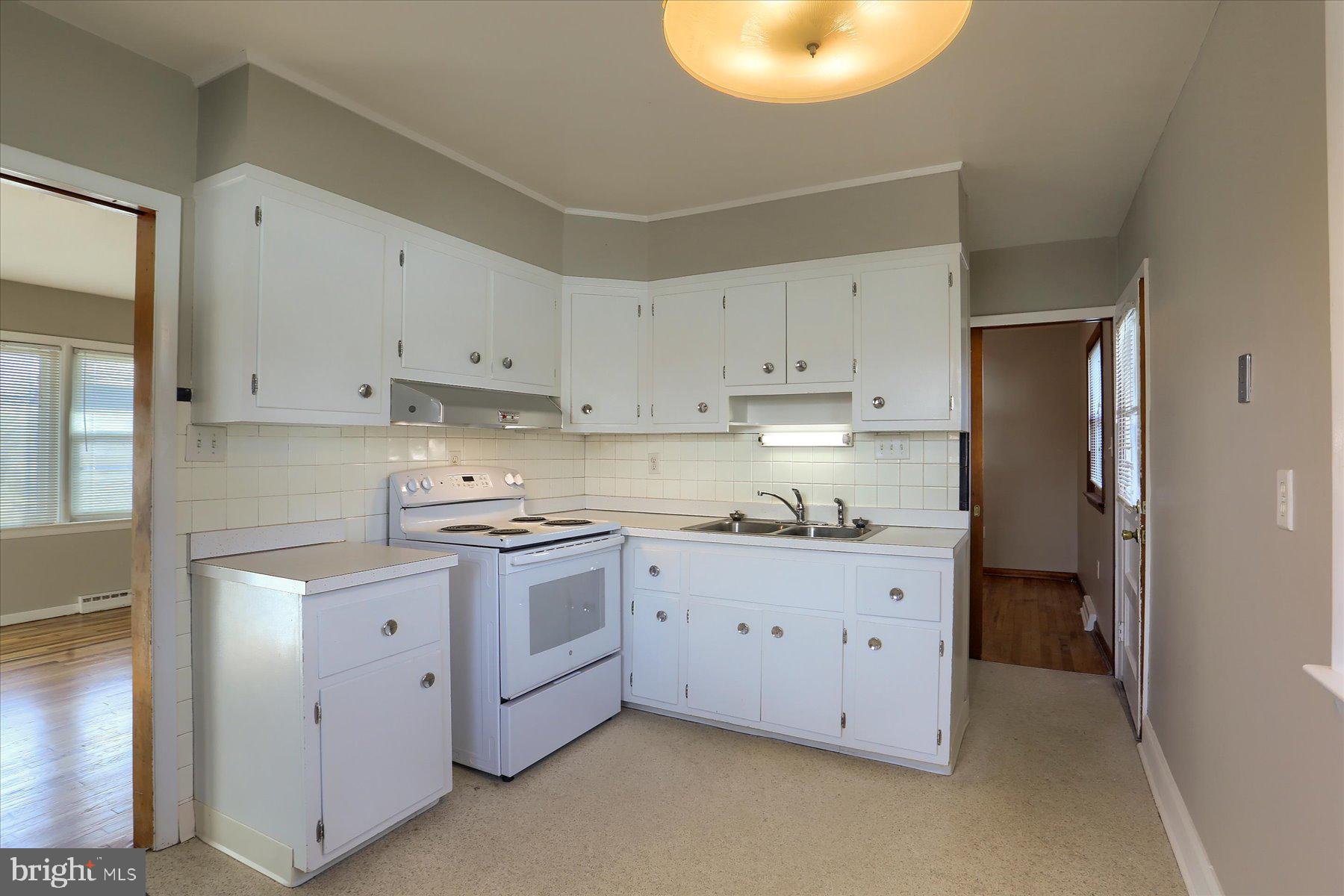 3240 Cloverfield Road Harrisburg, PA 17109 - Photo 9 of 28 a kitchen with cabinets and white appliances