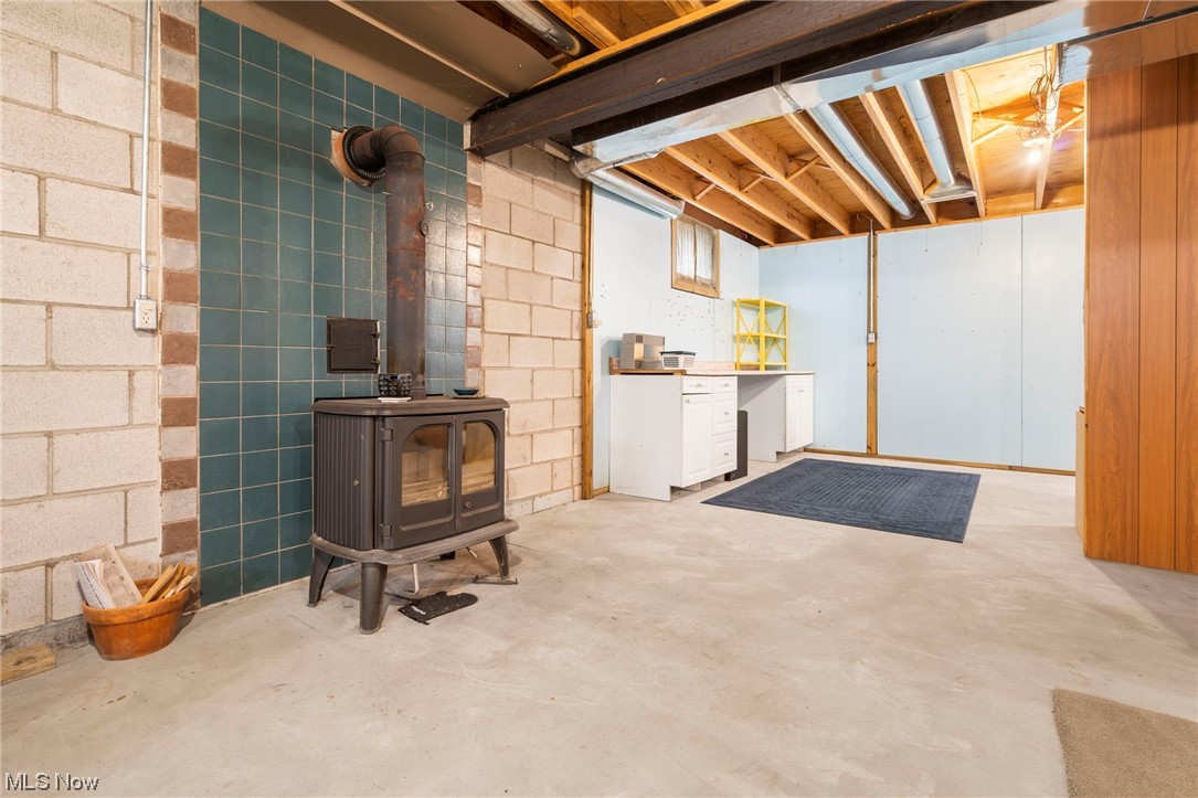 1004 Scio Road Carrollton, OH 44615 - Photo 26 of 35 Free standing woodburner in the basement