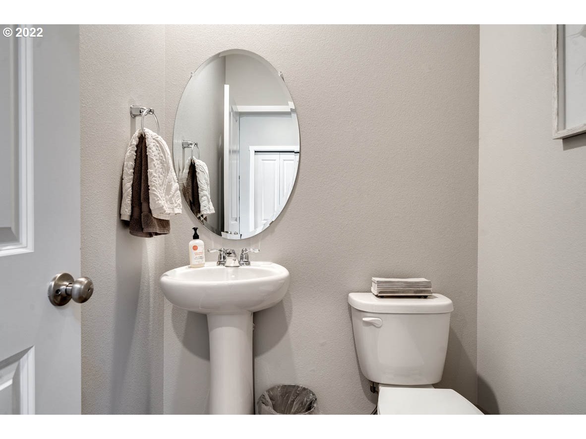 2866 Pierce Parkway Springfield, OR 97477 - Photo 6 of 14 a bathroom with a toilet sink and mirror