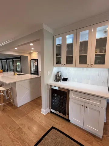 a kitchen with stainless steel appliances granite countertop a stove and a sink