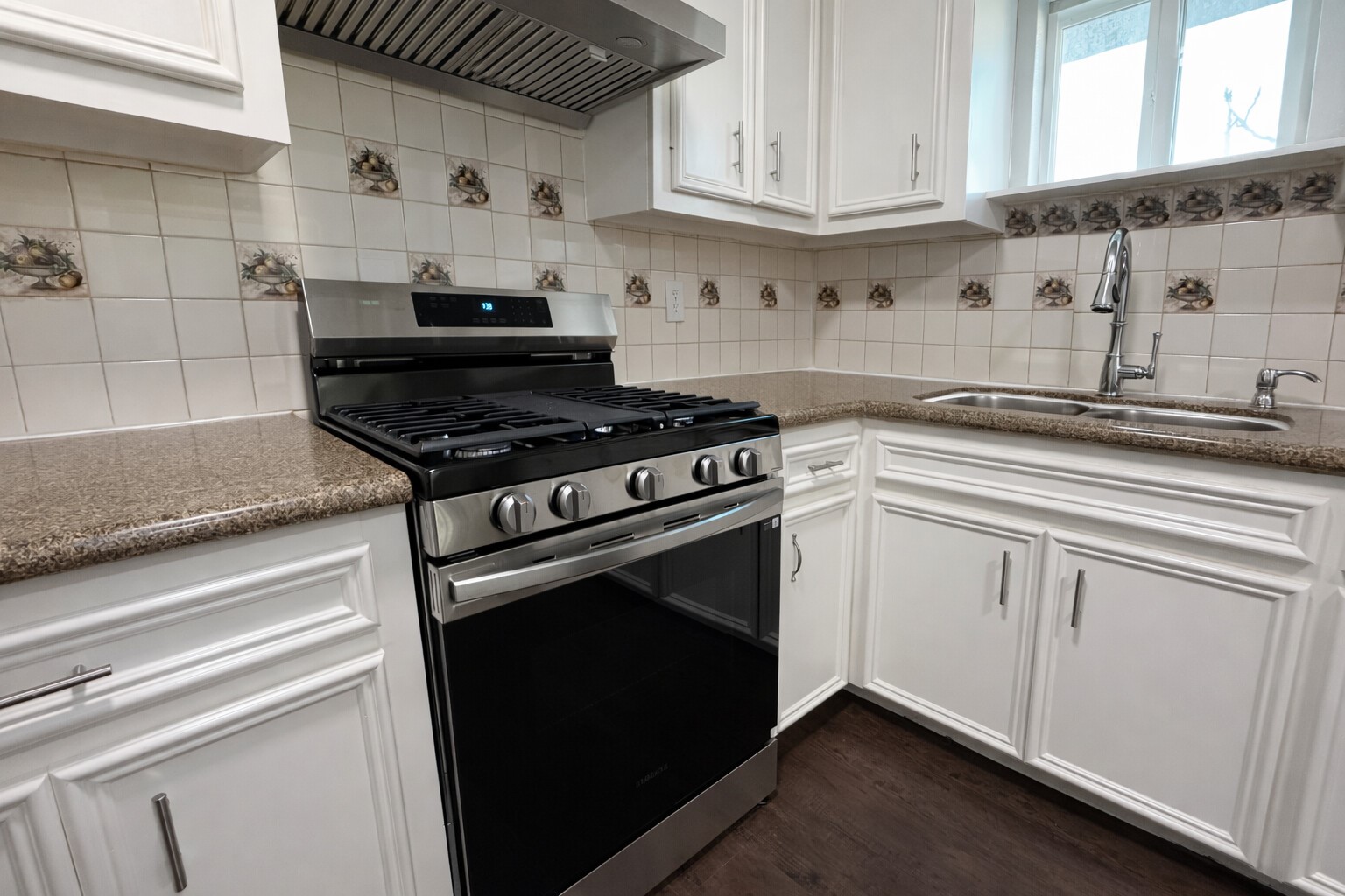 8226 Harding Street Houston, TX 77012 - Photo 6 of 13 a kitchen with white cabinets and appliances
