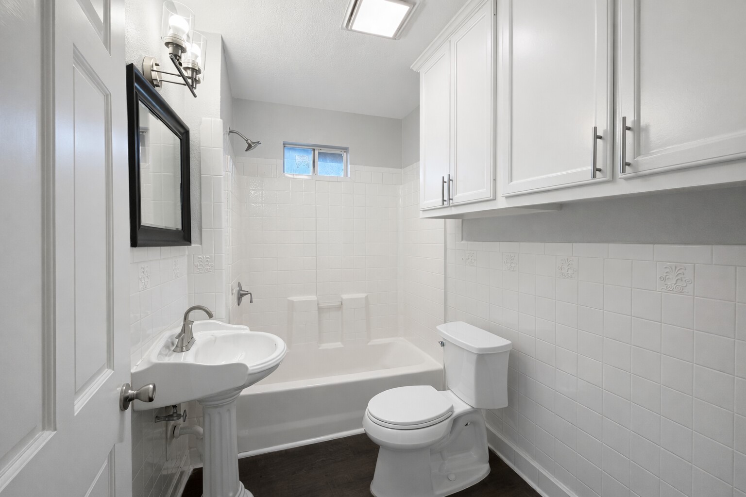 8226 Harding Street Houston, TX 77012 - Photo 7 of 13 a bathroom with a sink a toilet and mirror