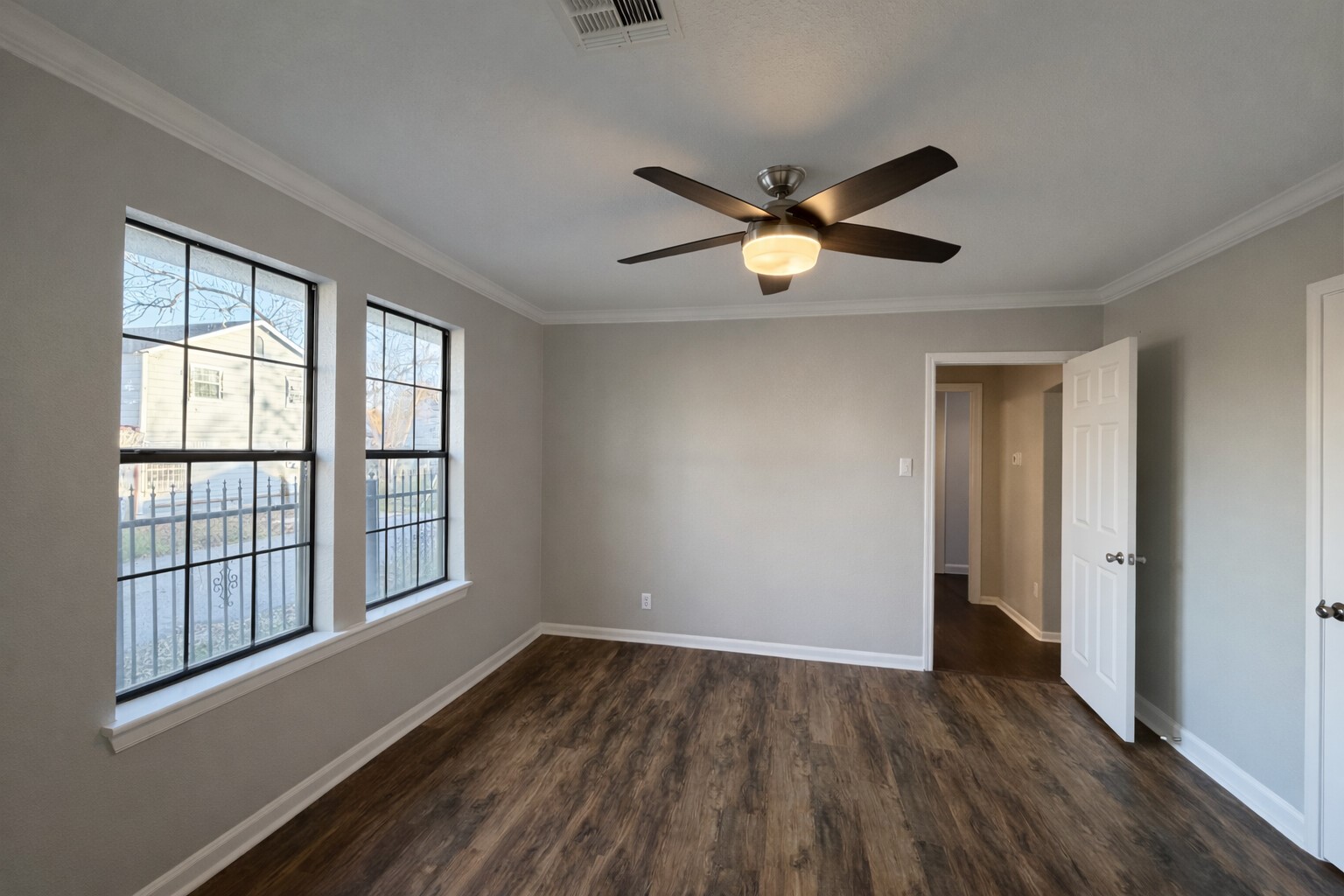8226 Harding Street Houston, TX 77012 - Photo 8 of 13 wooden floor in an empty room with a window