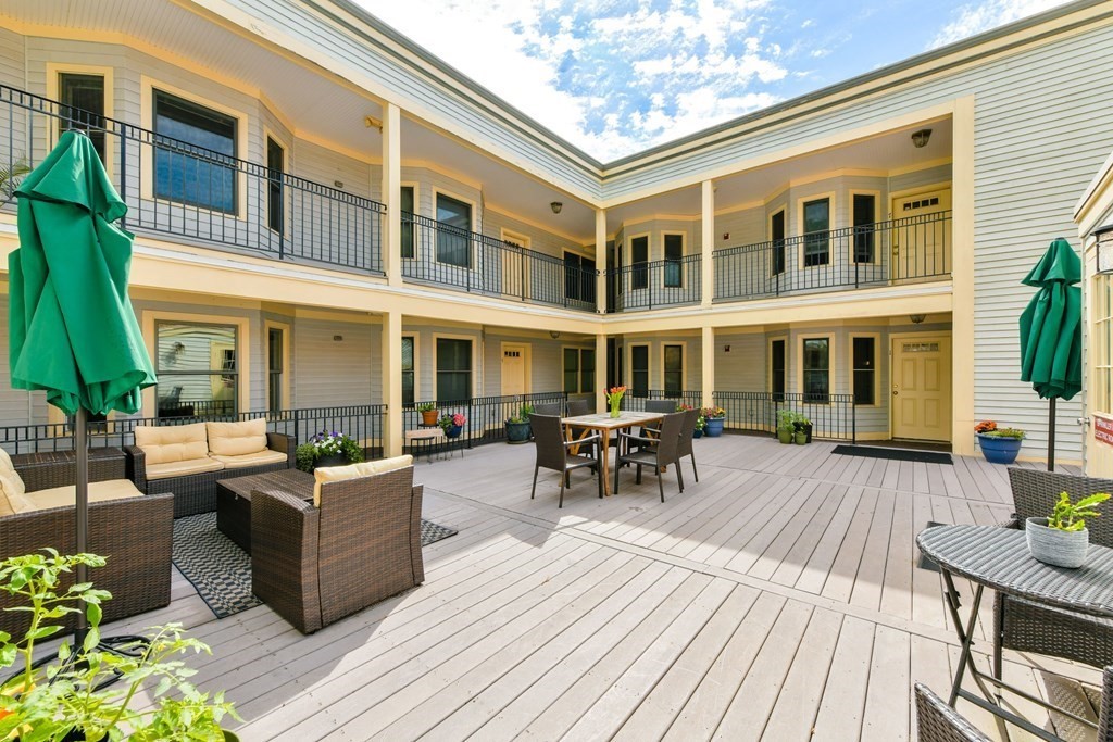 2 Lee Hill Road, Unit 6 Boston, MA 02131 - Photo 19 of 42 a view of a building with outdoor seating