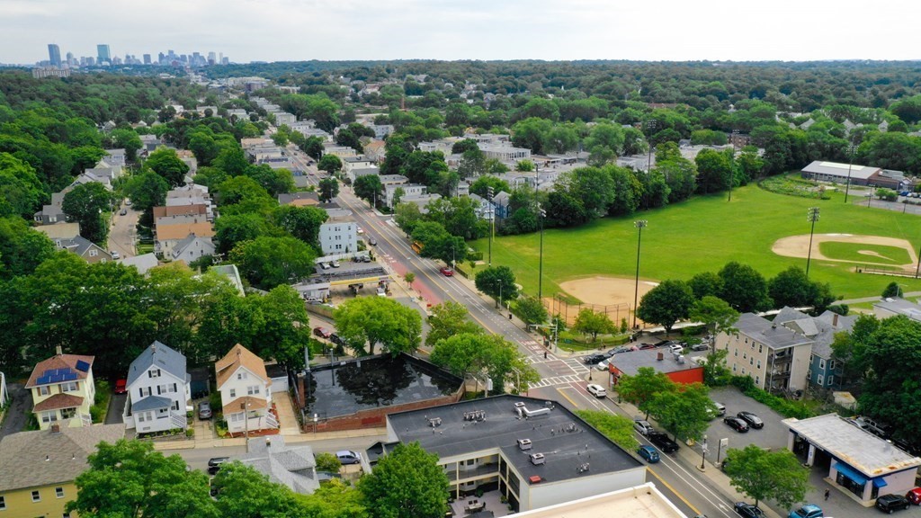 2 Lee Hill Road, Unit 6 Boston, MA 02131 - Photo 23 of 42 an aerial view of a house with garden space and street view