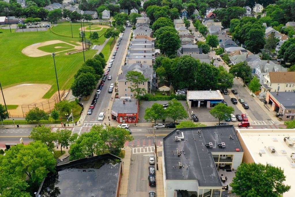 2 Lee Hill Road, Unit 6 Boston, MA 02131 - Photo 28 of 42 an aerial view of multiple houses with yard
