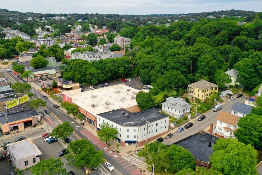 2 Lee Hill Road, Unit 6 Boston, MA 02131 - Photo 31 of 42 an aerial view of a house with yard