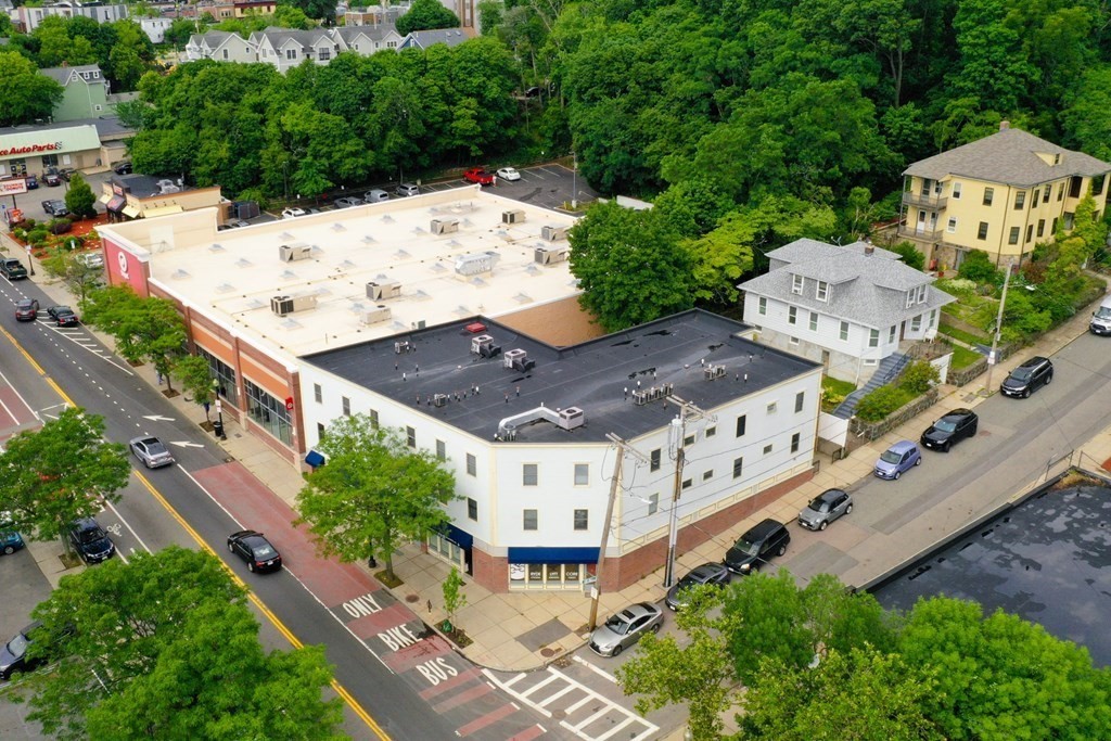 2 Lee Hill Road, Unit 6 Boston, MA 02131 - Photo 35 of 42 an aerial view of a house with a yard
