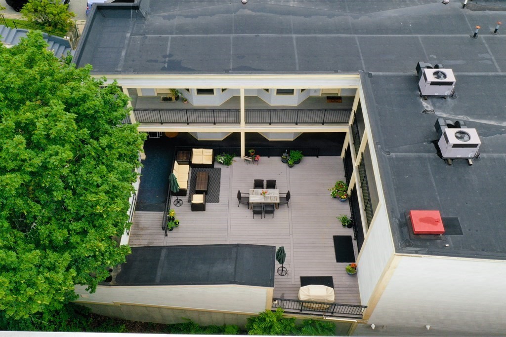 2 Lee Hill Road, Unit 6 Boston, MA 02131 - Photo 39 of 42 an aerial view of a house with swimming pool and porch