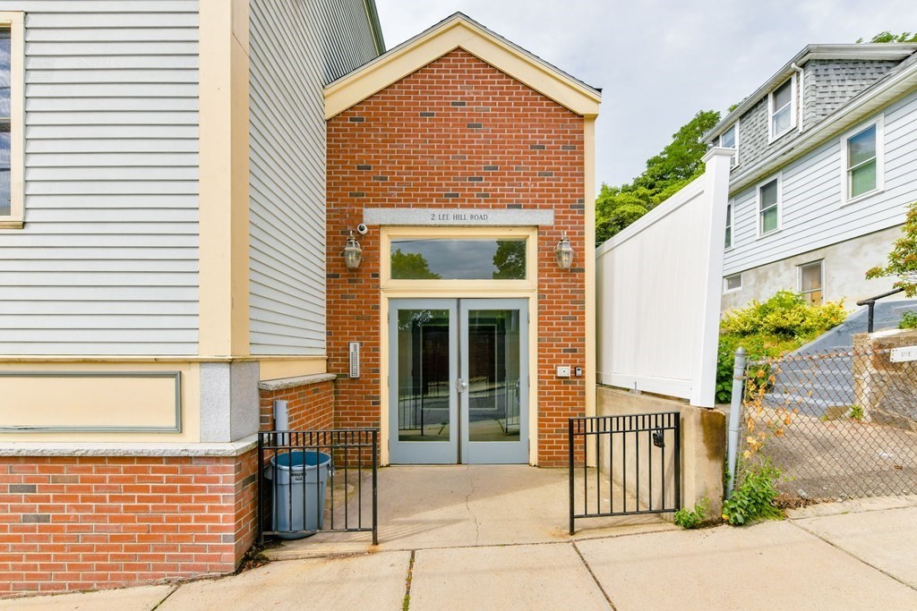 2 Lee Hill Road, Unit 6 Boston, MA 02131 - Photo 40 of 42 a front view of a house with a porch
