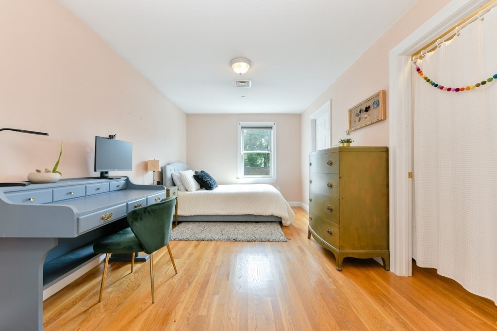 2 Lee Hill Road, Unit 6 Boston, MA 02131 - Photo 5 of 42 a very nice looking room with a large bed and wooden floor