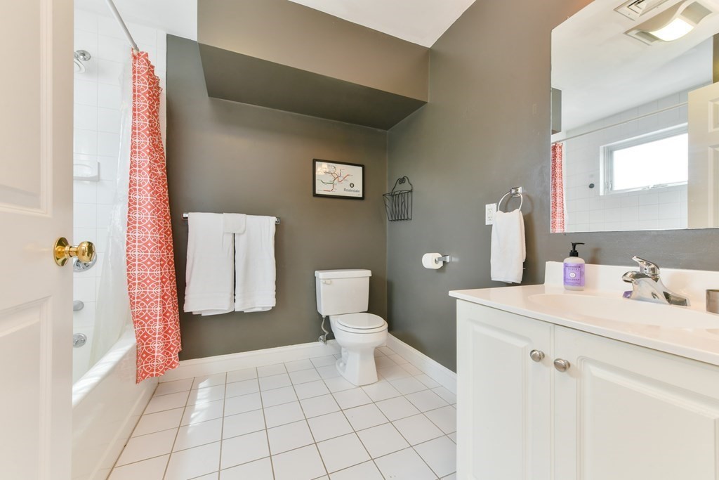 2 Lee Hill Road, Unit 6 Boston, MA 02131 - Photo 6 of 42 a bathroom with a sink a toilet and a mirror