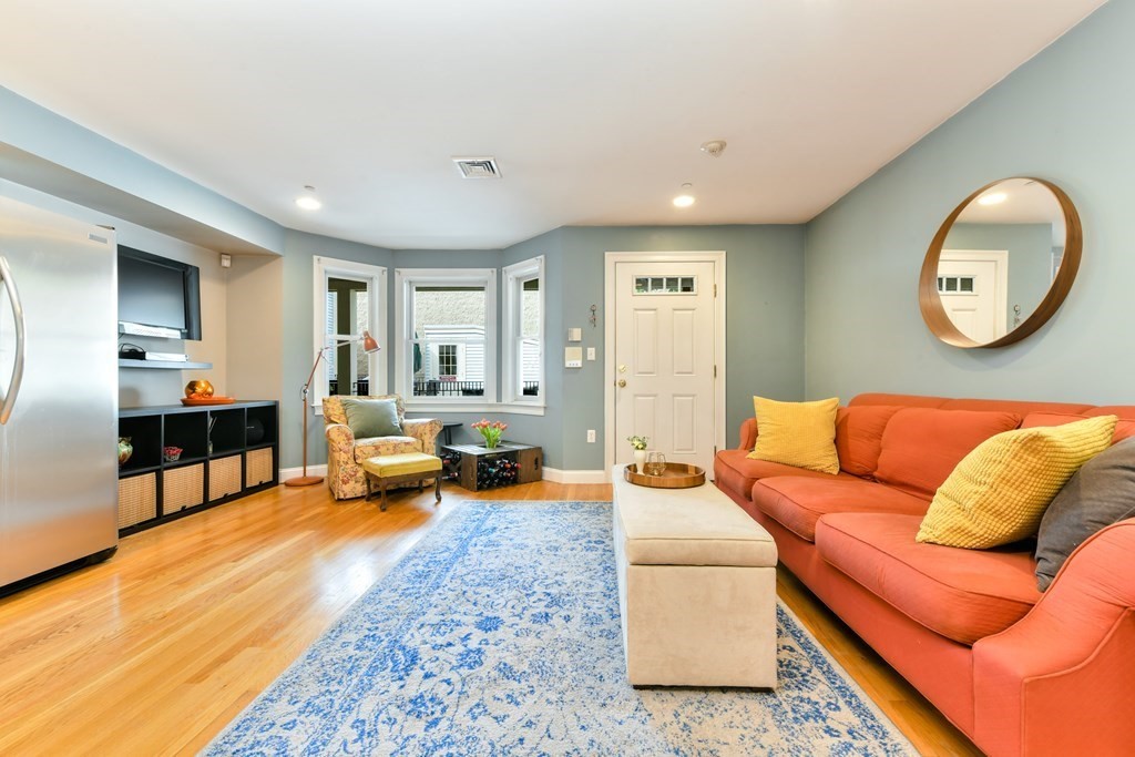 2 Lee Hill Road, Unit 6 Boston, MA 02131 - Photo 10 of 42 a living room with furniture and a couch